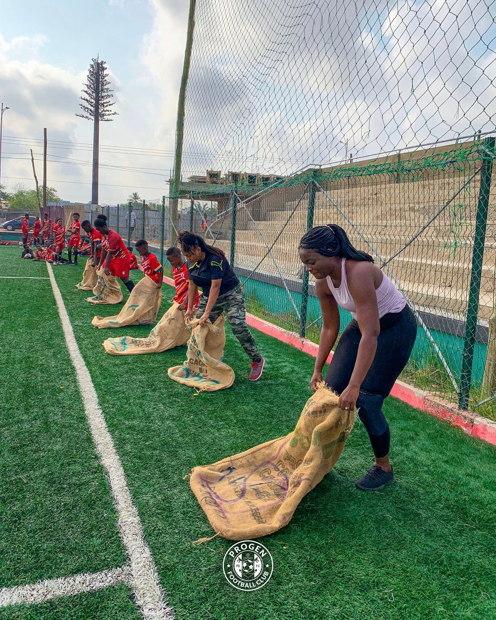 ProGen FC Ladies players lined up for a sack race on the pitch